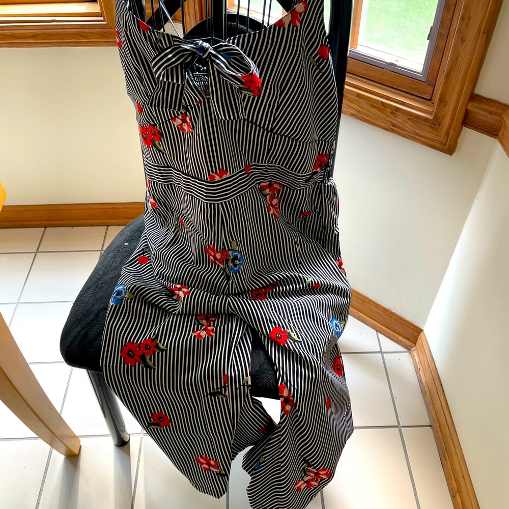 Adorable wash and wear jumpsuit with adjustable straps and elastic back